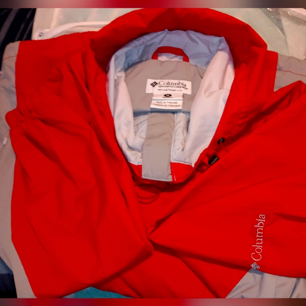 Women's Columbia red and gray raincoat.